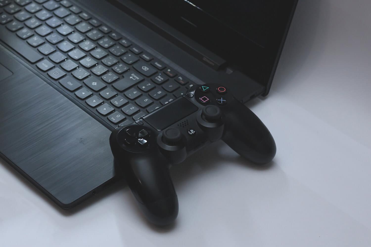 An image of a laptop and a game console